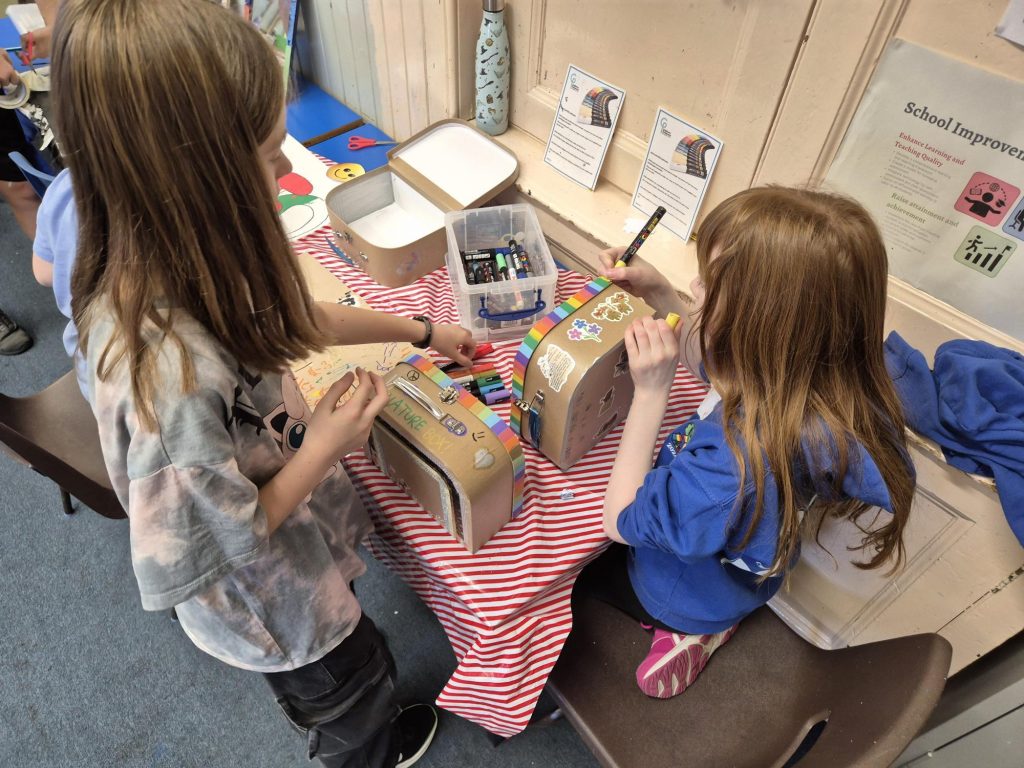 Members of Children's Parliament work on a creative project during a Children's Rights and A.I session.