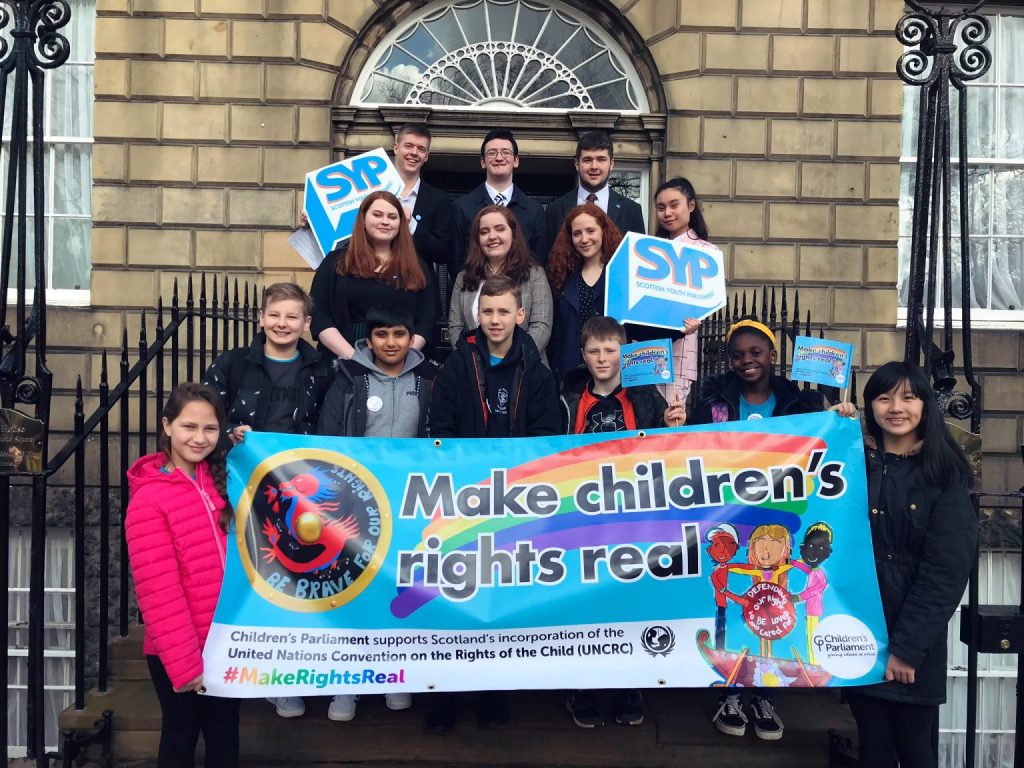 Members of Children's Parliament with representatives from Scottish Youth Parliament outside Bute House, Edinburgh, 2019.