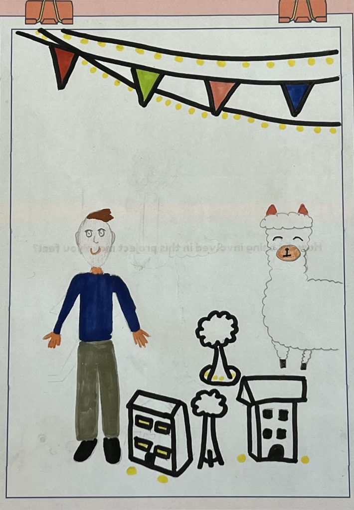 Flynn's self portrait, including colourful bunting, the Democracy Matters model town and a happy Alpaca.