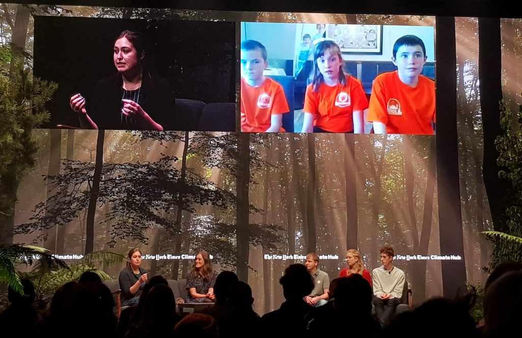 Children engage with speakers at the New York Times Climate Hub for Cop26 in 2021.