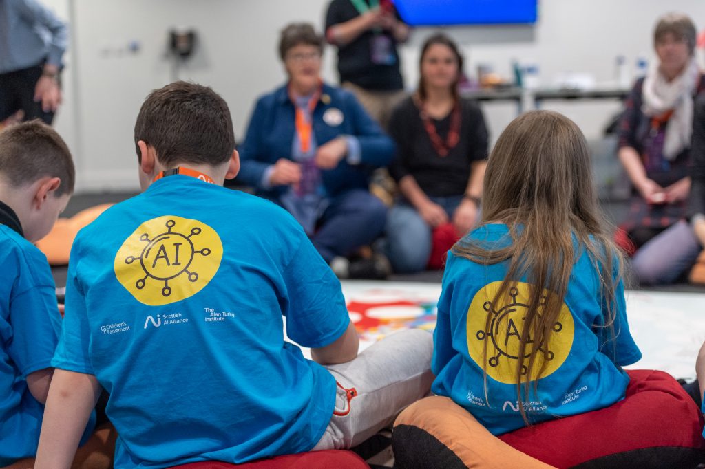 Members of Children's Parliament lead adults during an A.I workshop