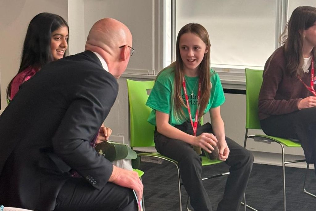 Tate speaking with now First Minister of Scotland, John Swinney MSP