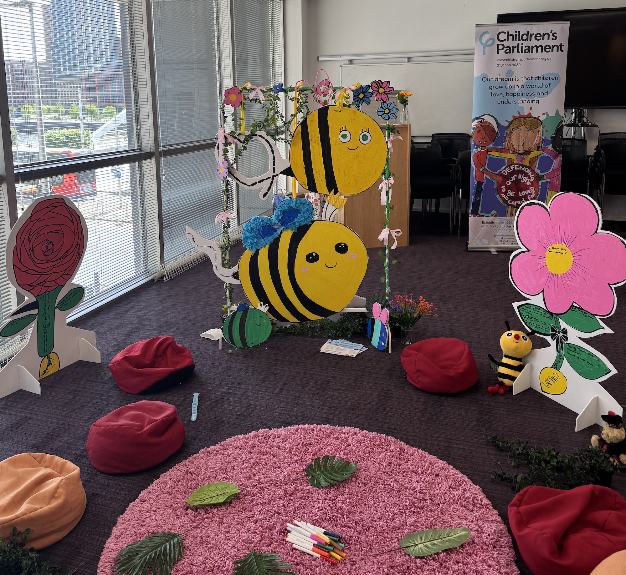 Members of Children's Parliament's artworks communicating their themes.