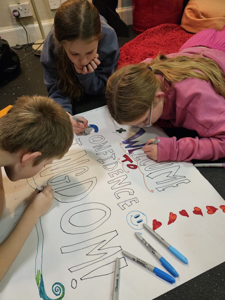 Democracy Matters Members of Children's Parliament creating a sign